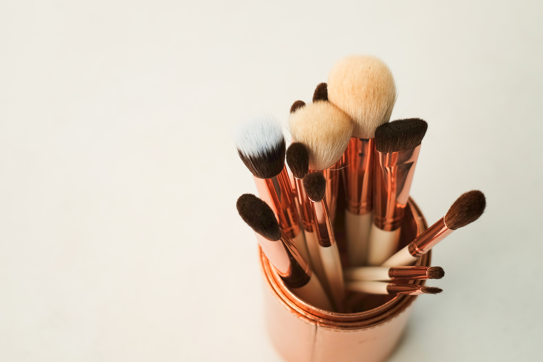 Makeup Brushes in a Copper Bucket